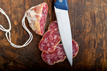 Image showing italian salame pressato pressed slicing