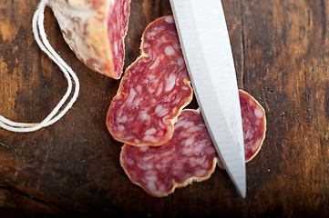 Image showing italian salame pressato pressed slicing