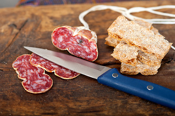 Image showing italian salame pressato pressed slicing