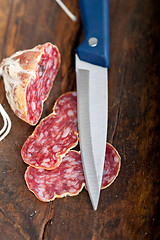 Image showing italian salame pressato pressed slicing