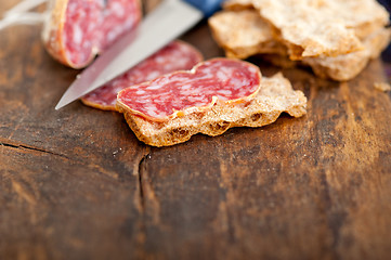 Image showing italian salame pressato pressed slicing