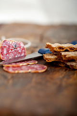 Image showing italian salame pressato pressed slicing