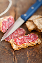 Image showing italian salame pressato pressed slicing