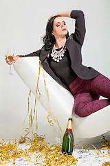 Image showing Seductive brunette holding a glass of champagne