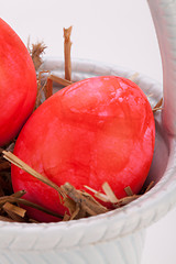 Image showing Basket of brightly coloured Easter Eggs