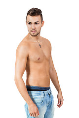 Image showing young attractive man in jeans and naked body isolated