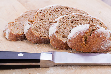 Image showing homemade fresh baked bread and knife 