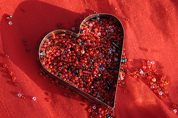 Image showing red heart on red silk