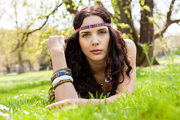 Image showing Pretty young woman in a headband daydreaming