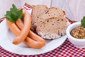 Image showing tasty sausages frankfurter with grain bread 