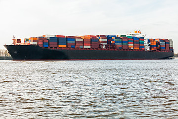 Image showing Fully laden container ship in port