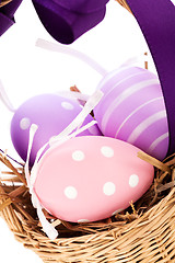 Image showing Straw basket with traditional Easter eggs