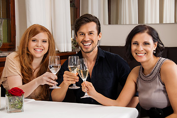 Image showing smiling happy people friends in restaurant