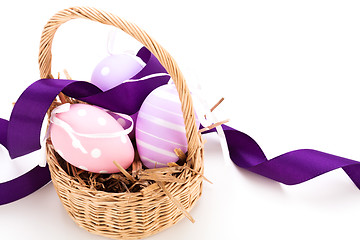 Image showing Straw basket with traditional Easter eggs