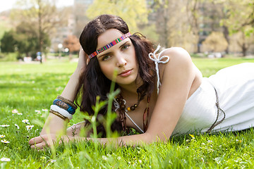 Image showing Pretty young woman in a headband daydreaming