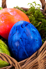 Image showing Basket of brightly coloured Easter Eggs