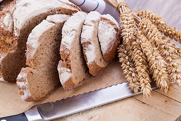 Image showing homemade fresh baked bread and knife 