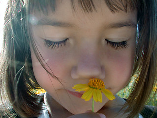 Image showing Little Girl and Flower