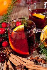 Image showing hot tasty spicy mulled red wine with orange and cinnamon christmas 