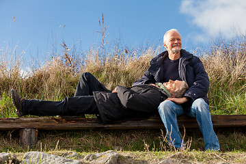 Image showing happy senior couple relaxing together in the sunshine