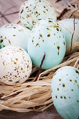 Image showing Three natural blue Easter eggs in a basket