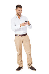 Image showing Handsome man reading a message on his mobile