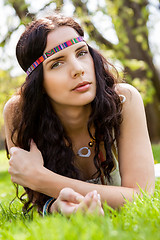 Image showing Pretty young woman in a headband daydreaming