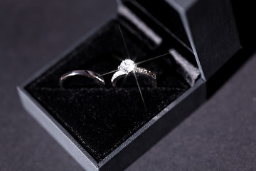 Image showing Engagement ring with a bunch of red roses