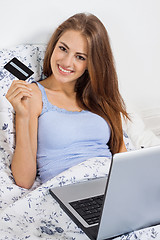 Image showing Beautiful woman doing online shopping