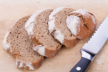 Image showing homemade fresh baked bread and knife 