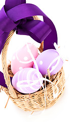 Image showing Straw basket with traditional Easter eggs