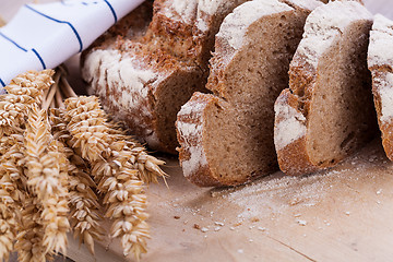 Image showing homemade fresh baked bread and knife 