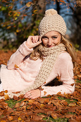 Image showing young smiling woman with hat and scarf outdoor in autumn