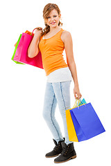 Image showing attractive young woman with colorful shopping bags