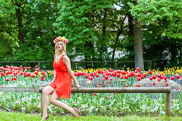 Image showing beautiful woman portrait outdoor with colorful flowers