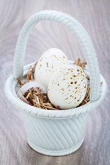 Image showing Three natural blue Easter eggs in a basket