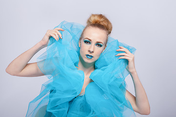 Image showing Elegant beautiful woman in a blue gauze ruff