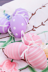 Image showing colorful easter egg decoration on wooden background