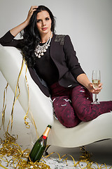 Image showing Seductive brunette holding a glass of champagne