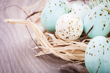 Image showing Three natural blue Easter eggs in a basket