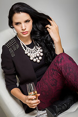 Image showing Seductive brunette holding a glass of champagne