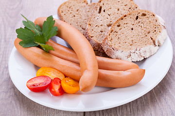 Image showing tasty sausages frankfurter with grain bread 