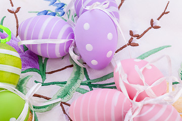 Image showing colorful easter egg decoration on wooden background