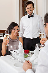 Image showing young smiling couple at the restaurant 