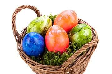 Image showing Basket of brightly coloured Easter Eggs