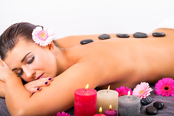 Image showing young attractive woman hot stone massage wellness