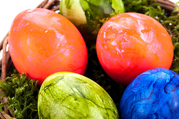 Image showing Basket of brightly coloured Easter Eggs