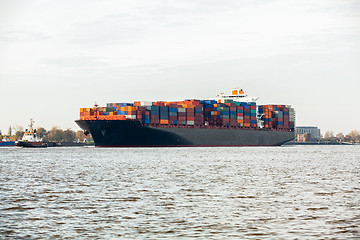 Image showing Fully laden container ship in port