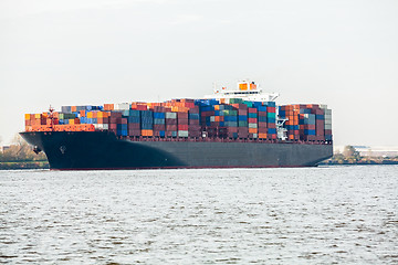 Image showing Fully laden container ship in port