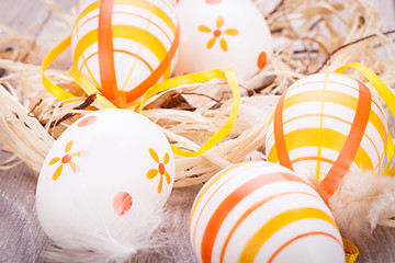 Image showing Decorative Easter eggs, on a rustic wooden table